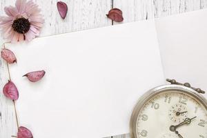 Paper mock-up with clock and petals photo