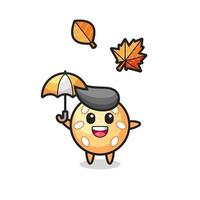 cartoon of the cute sesame ball holding an umbrella in autumn vector