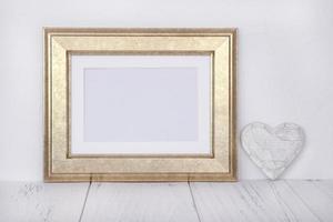 Golden frame with heart photo