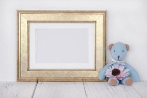 Golden frame with bear and flower photo