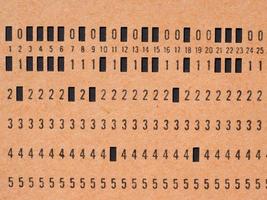 Orange punched card for programming photo