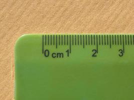 Green plastic metric ruler photo