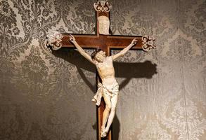 Old crucifix made of wood and ivory. photo