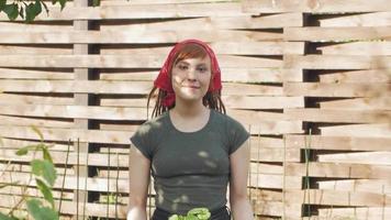 Young woman farmer work in garden video
