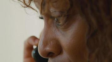 Close up of woman talking on smartphone video