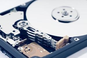 Close up of open Hard disk drive HDD. Computer hardware data storage photo