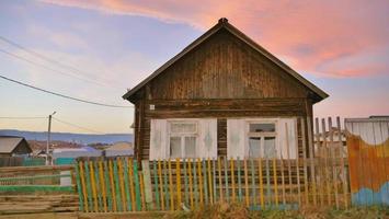 sunset view small wooden house in Olkhon Island, Irkutsk Russia photo