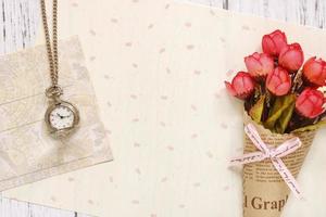 Floral paper with watch and flowers photo