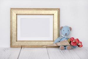 Gold frame with bear and flowers photo