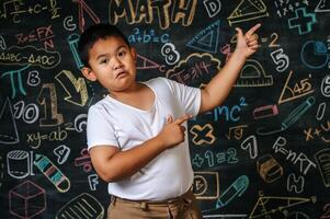 Child standing and acting in the classroom photo