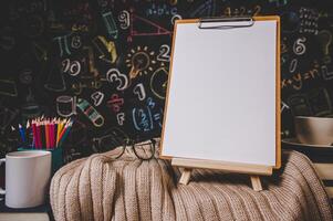 blank clipboard in the classroom photo