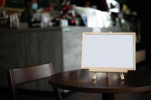 Picture frame placed on a table in a restaurant. photo