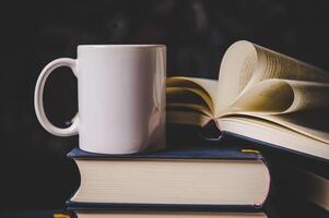 cup on the books in classroom photo