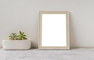 Standing picture frame with small potted plants photo