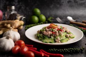 Stir fried zucchini with minced pork in white plate photo