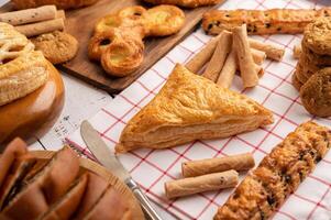 Various breads on red white cloth. Selective focus. photo