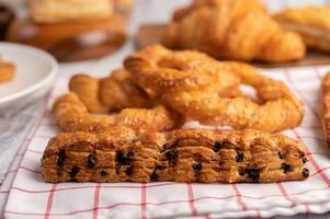 Various breads on red white cloth. Selective focus. photo