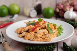 Stir Fried Chicken Chili Paste in White Dish. photo