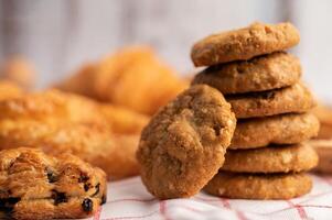 Cookies stacked on a white-red cloth. Selective focus. photo