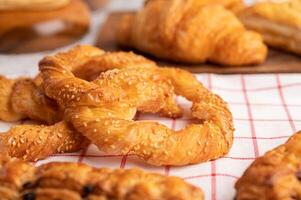 Various breads on red white cloth. Selective focus. photo