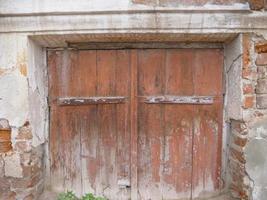 Retro vintage old broken brick wall wooden door photo