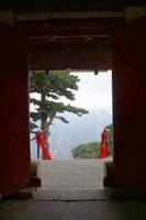 landscape view of Mount Huashan from a old ancient temple door photo