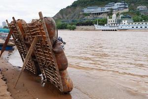 Sheepskin raft by the Yellow River in Lanzhou Gansu China photo