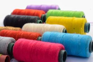 Yarn Textile,Spool of colorful clothes sewing thread photo