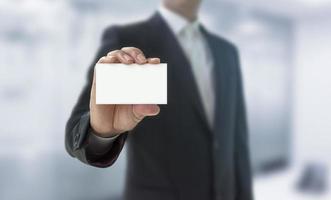 Man showing a business card