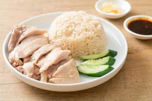 Hainanese chicken rice or rice steamed with chicken soup photo