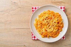 Spaghetti pasta with creamy tomato sauce photo