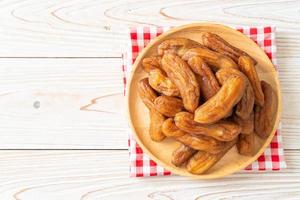 Sun dried banana on plate photo