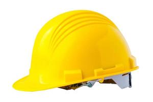 Yellow construction helmet with blueprint, engineer safety concept. photo