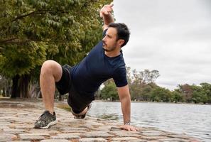 Man trains with Animal Flow workout to elevate his body weight workout photo