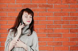 pretty girl talking by cellphone, eyes closed, dreamingly smiling photo