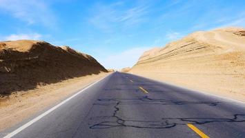 Landscape view of sunny blue sky and high way road in Qinghai China photo