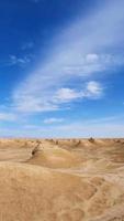 Yardang landform and sunny blue sky in Dunhuang Gansu China photo