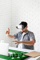 Engineer or designer using VR glasses visualising photo