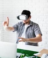 designer using VR glasses visualising reneable energy project photo