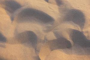 Desert sand under sunlight background texture image. photo