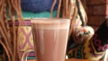 Young woman drink cocoa video