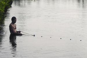 Sorong, Indonesia 2021- Pond fishermen photo