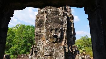 Face tower at the Bayon Temple, Siem Reap Cambodia photo