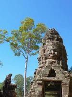 Stone carving of face at Banteay Kdei, in Siem Reap Cambodia photo
