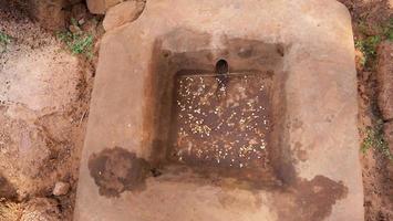 Stone basin for washing bone at buddhist khmer of Pre Rup Siem Reap photo