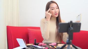 Young asian woman online review cosmetic video