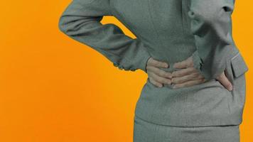 Back Pain. Business woman with back injury. video