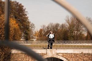 Romantic couple in autumn park - love, relationship and dating concept photo