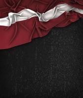 Latvia Flag Vintage on a Grunge Black Chalkboard With Space For Text photo