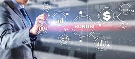 Businessman clicks a bonds virtual screen. Bond photo